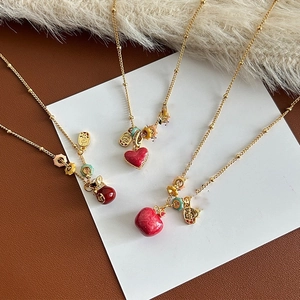 18k gold plated necklace featuring lucky bag pendants and red enamel charms