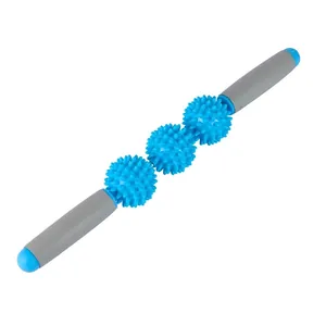 Detail of three blue spiky massage balls on a foam roller stick with grey ergonomic handles