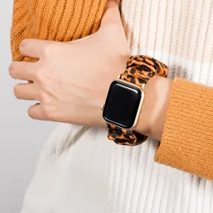 Leopard print scrunchie elastic watch band for Apple Watch on a female wrist