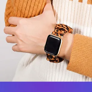 Leopard print scrunchie elastic watch band for Apple Watch on a female wrist