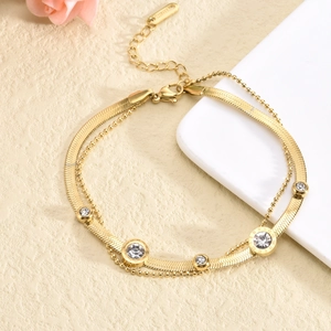 Double-layered gold titanium steel bracelet with snake chain and round zircon accents