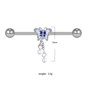Silver butterfly industrial barbell with blue enamel wings and teardrop chain charms