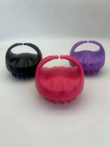 Detailed view of silicone scalp massagers in black, purple and rose red color options