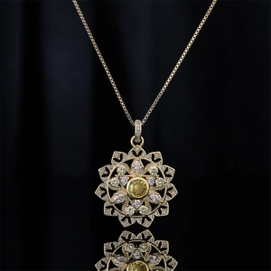 Luxury 18K gold plated necklace with a geometric flower pendant and yellow gemstones