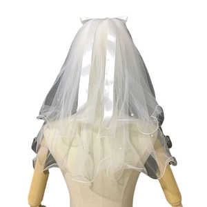 Double-layer bridal veil with white satin bow and delicate pearl beads on mesh