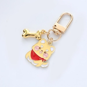 Cartoon Shiba Inu metal keychain with golden bone charm and red scarf detailing