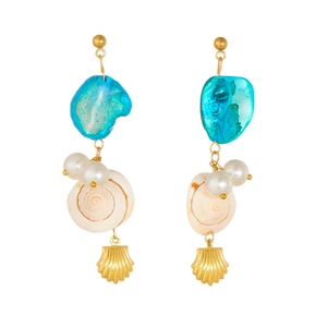 Close-up of golden shell earrings with turquoise stones and white pearls on white background