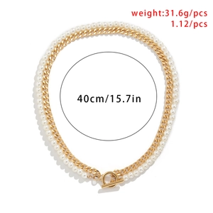Detail view of double-layer necklace with gold curb chain, faux pearls, and OT toggle clasp