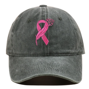 Close-up of pink ribbon feather embroidery on washed cotton charcoal baseball cap