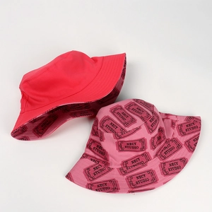 Close-up of bucket hat interior with repeating NECY STUDIO typography print and fine stitching