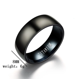 Detailed macro of 8mm matte black titanium steel ring with internal material engraving
