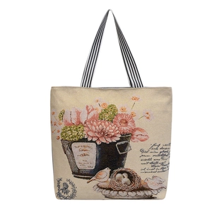 Retro bird and flower printed tote bag in beige woven fabric with striped handles