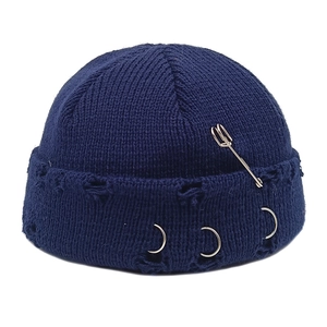 Hip-hop dark blue knit docker hat with decorative metal rings and safety pin detail