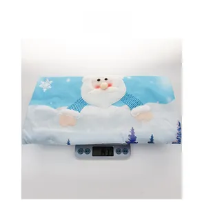 Coprisedia natalizio con motivo Babbo Natale su bilancia che mostra il peso di 143g