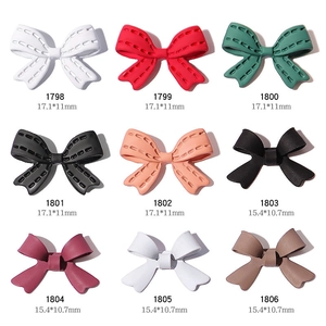 Nail art 3D bowknot charms in multiple colors and matte finishes for manicure design