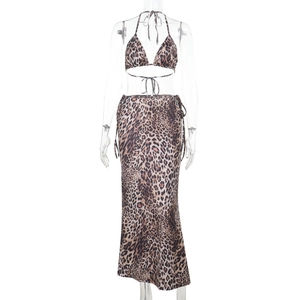 Detail of leopard print tie-front long skirt and halter bikini set in brown and black