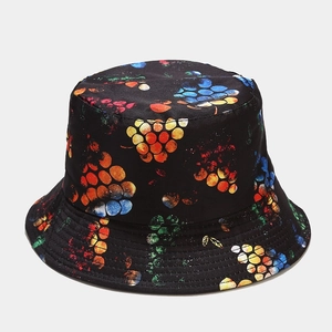 Close-up of reversible bucket hat with colorful lemon pattern and durable cotton twill texture