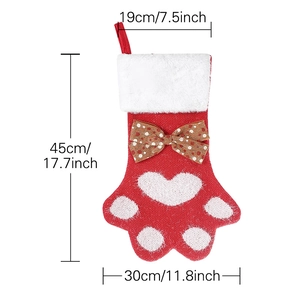 Chaussette de Noël tricotée en forme de patte rouge avec revers en peluche et nœud décoratif