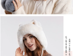Detail of white faux fur winter hat with cute cat ears and warm ear flaps for women