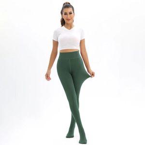 Close-up of high-elasticity fabric on dark green high-waist thermal leggings
