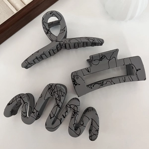 Three-piece set of matte grey hair claws with black graffiti patterns and strong grip