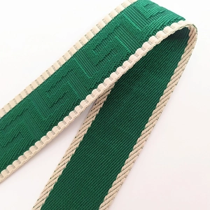 Adjustable wide green guitar style strap with Greek key pattern and beige wavy trim
