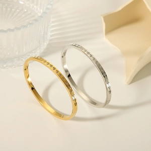 Elegant 18k gold and silver rhombus bracelets with sparkling zircons in a minimal design