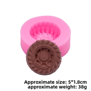 Detail of pink tire silicone mold showing exact 5x1.8cm dimensions and tread pattern