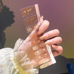 Fashionable nail polish wraps with gold foil and round patterns on transparent base