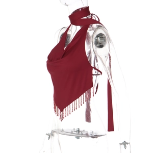 Detail of burgundy halter top with silky fabric and layered fringe beaded hemline