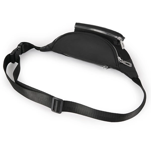 Detailed close-up of water-resistant black nylon waist bag with multiple silver zippers