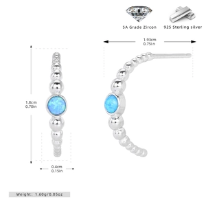 Detail view of S925 sterling silver C-shaped earrings featuring blue 5A grade zircon stones