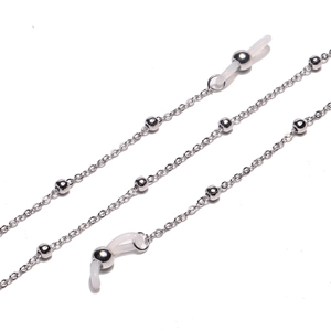 Detail of silver beaded eyeglass chain with clear silicone non-slip rubber connectors