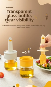 Detail of cartoon duck silicone oil brush with glass bottle for kitchen seasoning