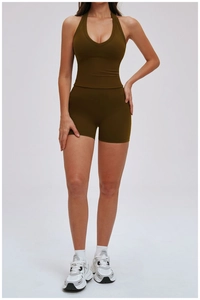 Olive green yoga set featuring a halter V-neck sports bra and high-waisted shorts