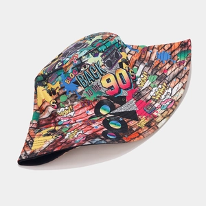 Detail of 90s retro graffiti print bucket hat featuring radio and vinyl record patterns