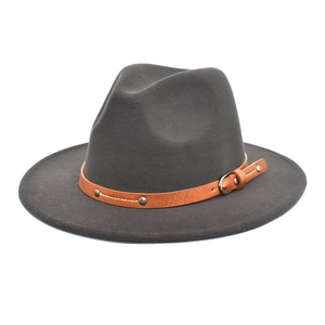 Detailed macro view of dark grey wool fedora hat with brown leather band and metal buckle