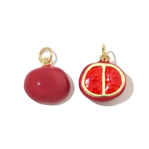 Detailed macro view of creative pomegranate fruit pendants with vibrant red enamel finish