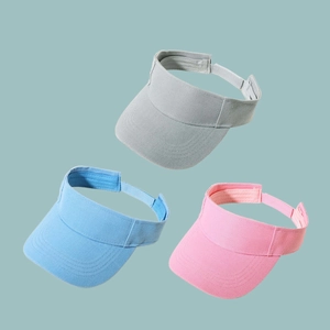 Three sun visor baseball caps in grey, blue, and pink with adjustable back straps
