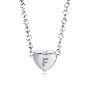 Detailed view of silver heart pendant with engraved letter F on a minimalist chain