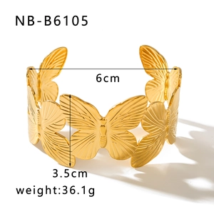 Detailed view of 18K gold butterfly cuff bracelet with 6cm inner diameter and 3.5cm width