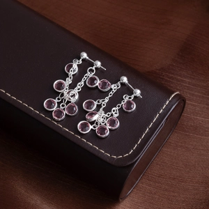 Elegant silver tassel earrings featuring pink round-cut gemstones and multi-layer chains
