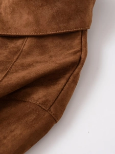 Close-up of premium brown suede fabric texture with high-quality stitching details