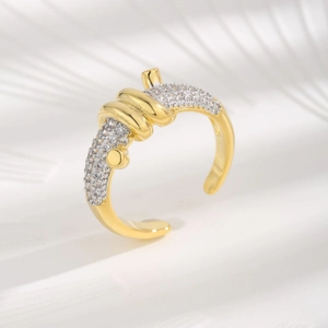 Adjustable gold ring with knot design and micro-paved cubic zirconia stones