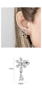 Detail view of zircon snowflake drop earrings measuring 1.7cm by 0.8cm on silver