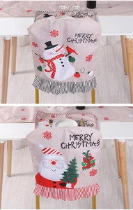 Detail of Christmas chair covers with Santa and Snowman prints and ruffled hem decor