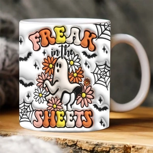 Detail of ceramic Halloween mug featuring Spooky ghost and Freak in the Sheets text design