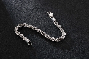 Macro shot of 6mm silver stainless steel twisted rope chain with secure lobster clasp