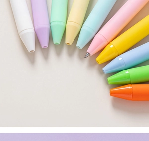 Macro detail of macaron color retractable ballpoint pens arranged in a neat fan shape