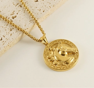 Macro detail of golden 3D horse head pendant with Greek fret border on square link chain